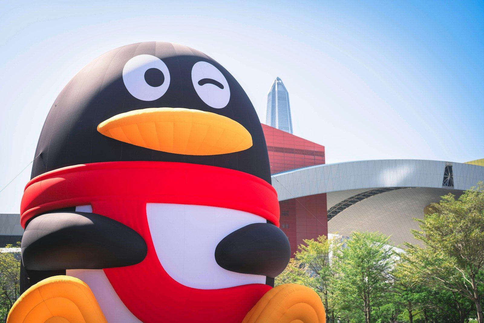 A large penguin statue in front of a building